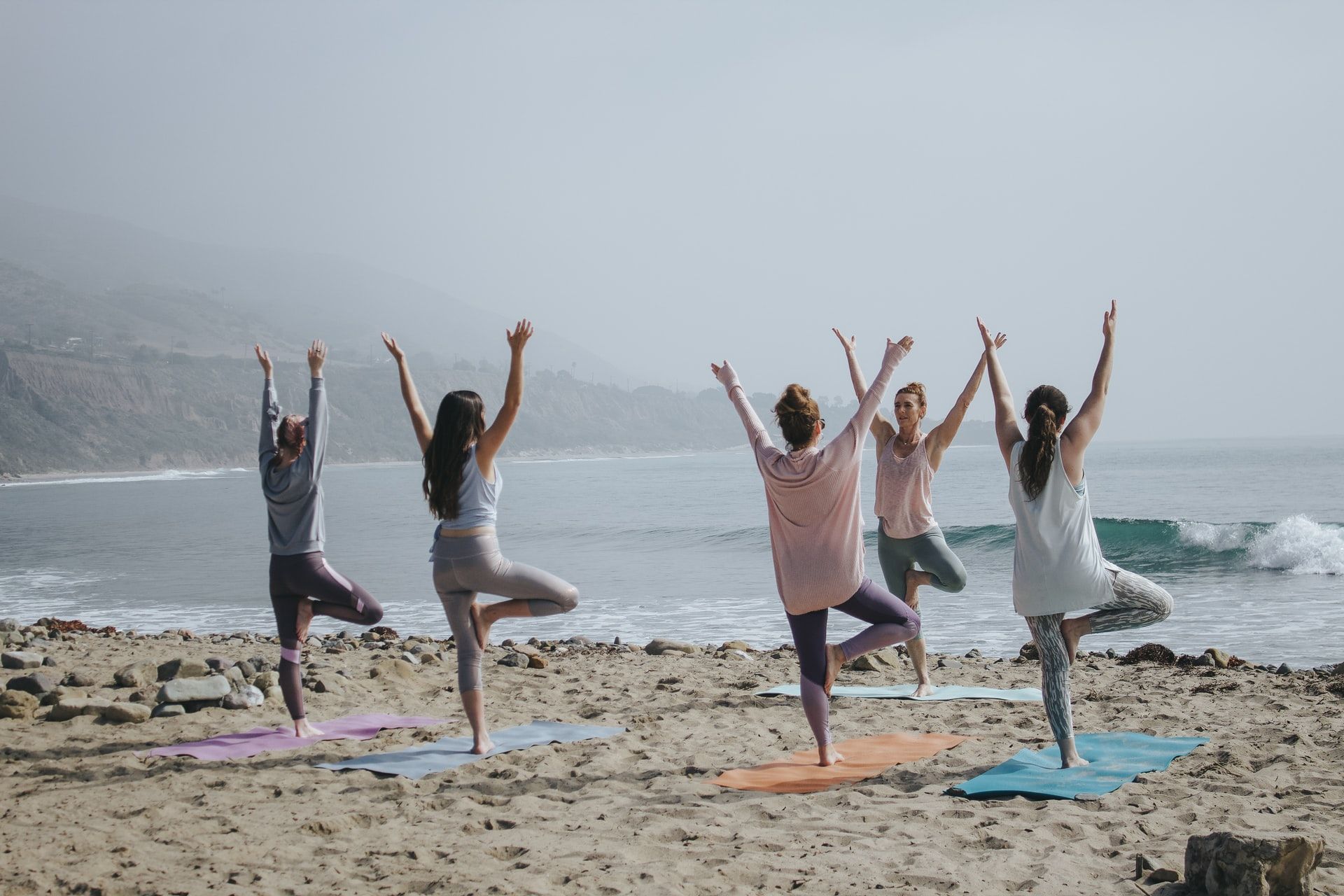 yoga on the beach__how to plan a corporate retreat_flok